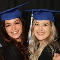 GradFest attendees hug each other for a picture